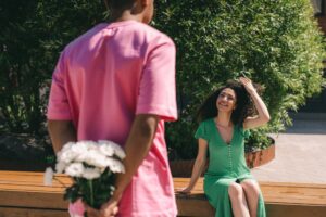 A Man Surprising a Woman with a Bouquet of Flowers